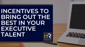 Graphic with laptop on desk: Incentives To Bring Out The Best In Your Executive Talent